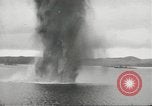 Standbild japanische Kriegsschiffe Brand bei uns Flugzeuge über Insel Kiska Aleutians, 1942, aus Sekunde 36 historischem Filmmaterial Videoclip 65675075195