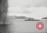 Standbild japanische Kriegsschiffe Brand bei uns Flugzeuge über Insel Kiska Aleutians, 1942, aus Sekunde 40 historischem Filmmaterial Videoclip 65675075195