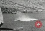 Standbild japanische Kriegsschiffe Brand bei uns Flugzeuge über Insel Kiska Aleutians, 1942, aus Sekunde 51 historischem Filmmaterial Videoclip 65675075195