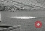 Standbild japanische Kriegsschiffe Brand bei uns Flugzeuge über Insel Kiska Aleutians, 1942, aus Sekunde 53 historischem Filmmaterial Videoclip 65675075195