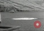 Standbild japanische Kriegsschiffe Brand bei uns Flugzeuge über Insel Kiska Aleutians, 1942, aus Sekunde 56 historischem Filmmaterial Videoclip 65675075195