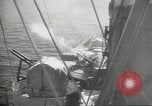 Standbild japanische Kriegsschiffe Brand bei uns Flugzeuge über Insel Kiska Aleutians, 1942, aus Sekunde 57 historischem Filmmaterial Videoclip 65675075195