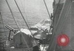 Standbild japanische Kriegsschiffe Brand bei uns Flugzeuge über Insel Kiska Aleutians, 1942, aus Sekunde 58 historischem Filmmaterial Videoclip 65675075195