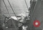 Standbild japanische Kriegsschiffe Brand bei uns Flugzeuge über Insel Kiska Aleutians, 1942, aus Sekunde 59 historischem Filmmaterial Videoclip 65675075195