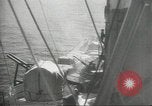 Standbild japanische Kriegsschiffe Brand bei uns Flugzeuge über Insel Kiska Aleutians, 1942, aus Sekunde 60 historischem Filmmaterial Videoclip 65675075195
