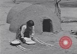 Image of Pueblo Native American Indian food preparation United States USA, 1920, second 32 stock footage video 65675075281