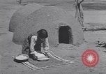 Image of Pueblo Native American Indian food preparation United States USA, 1920, second 36 stock footage video 65675075281