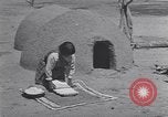 Image of Pueblo Native American Indian food preparation United States USA, 1920, second 37 stock footage video 65675075281