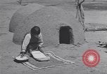 Image of Pueblo Native American Indian food preparation United States USA, 1920, second 43 stock footage video 65675075281