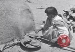 Image of Pueblo Native American Indian food preparation United States USA, 1920, second 56 stock footage video 65675075281