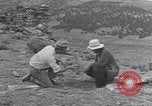 Image of archaeologists at Native American Indian Pueblo site Utah United States USA, 1937, second 24 stock footage video 65675075287