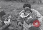 Immagine di Native American Indian bambini mangiare anguria United States USA, 1933, secondo 22 filmato di repertorio 65675075293