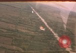 Image of aerial views of napalm bomb explosions in Vietnam War Vietnam, 1962, second 1 stock footage video 65675075352