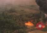 Image of aerial views of napalm bomb explosions in Vietnam War Vietnam, 1962, second 36 stock footage video 65675075352