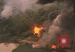 Image of aerial views of napalm bomb explosions in Vietnam War Vietnam, 1962, second 39 stock footage video 65675075352