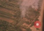 Image of aerial views of napalm bomb explosions in Vietnam War Vietnam, 1962, second 58 stock footage video 65675075352