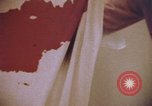 Image of blood stained clothing United States USA, 1969, second 3 stock footage video 65675075429