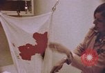 Image of blood stained clothing United States USA, 1969, second 5 stock footage video 65675075429