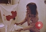 Image of blood stained clothing United States USA, 1969, second 10 stock footage video 65675075429