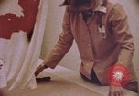 Image of blood stained clothing United States USA, 1969, second 13 stock footage video 65675075429