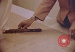 Image of blood stained clothing United States USA, 1969, second 14 stock footage video 65675075429