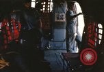 Image of U.S. and Montagnard troops parachute from CH-3E helicopter Vietnam, 1967, second 5 stock footage video 65675075610