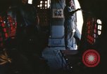 Image of U.S. and Montagnard troops parachute from CH-3E helicopter Vietnam, 1967, second 7 stock footage video 65675075610