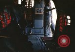 Image of U.S. and Montagnard troops parachute from CH-3E helicopter Vietnam, 1967, second 9 stock footage video 65675075610