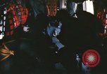 Image of U.S. and Montagnard troops parachute from CH-3E helicopter Vietnam, 1967, second 12 stock footage video 65675075610