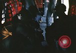 Image of U.S. and Montagnard troops parachute from CH-3E helicopter Vietnam, 1967, second 14 stock footage video 65675075610