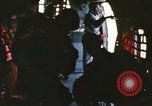 Image of U.S. and Montagnard troops parachute from CH-3E helicopter Vietnam, 1967, second 18 stock footage video 65675075610