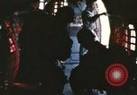 Image of U.S. and Montagnard troops parachute from CH-3E helicopter Vietnam, 1967, second 19 stock footage video 65675075610