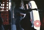 Image of U.S. and Montagnard troops parachute from CH-3E helicopter Vietnam, 1967, second 24 stock footage video 65675075610