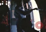 Image of U.S. and Montagnard troops parachute from CH-3E helicopter Vietnam, 1967, second 25 stock footage video 65675075610