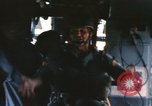 Image of U.S. and Montagnard troops parachute from CH-3E helicopter Vietnam, 1967, second 34 stock footage video 65675075610