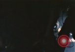 Image of U.S. and Montagnard troops parachute from CH-3E helicopter Vietnam, 1967, second 39 stock footage video 65675075610