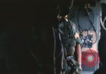 Image of U.S. and Montagnard troops parachute from CH-3E helicopter Vietnam, 1967, second 41 stock footage video 65675075610