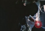 Image of U.S. and Montagnard troops parachute from CH-3E helicopter Vietnam, 1967, second 46 stock footage video 65675075610
