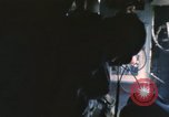 Image of U.S. and Montagnard troops parachute from CH-3E helicopter Vietnam, 1967, second 47 stock footage video 65675075610