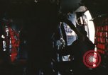 Image of U.S. and Montagnard troops parachute from CH-3E helicopter Vietnam, 1967, second 48 stock footage video 65675075610