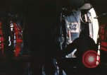 Image of U.S. and Montagnard troops parachute from CH-3E helicopter Vietnam, 1967, second 49 stock footage video 65675075610