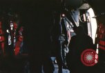 Image of U.S. and Montagnard troops parachute from CH-3E helicopter Vietnam, 1967, second 50 stock footage video 65675075610