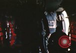 Image of U.S. and Montagnard troops parachute from CH-3E helicopter Vietnam, 1967, second 51 stock footage video 65675075610