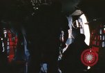 Image of U.S. and Montagnard troops parachute from CH-3E helicopter Vietnam, 1967, second 53 stock footage video 65675075610