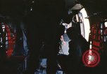 Image of U.S. and Montagnard troops parachute from CH-3E helicopter Vietnam, 1967, second 54 stock footage video 65675075610