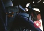Image of U.S. and Montagnard troops parachute from CH-3E helicopter Vietnam, 1967, second 60 stock footage video 65675075610
