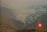 Image of Flames rising above tall trees California United States USA, 1987, second 36 stock footage video 65675075621