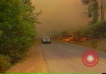Image of Flames rising above tall trees California United States USA, 1987, second 41 stock footage video 65675075621