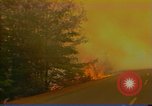 Image of Flames rising above tall trees California United States USA, 1987, second 49 stock footage video 65675075621