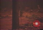 Image of Flames rising above tall trees California United States USA, 1987, second 54 stock footage video 65675075621